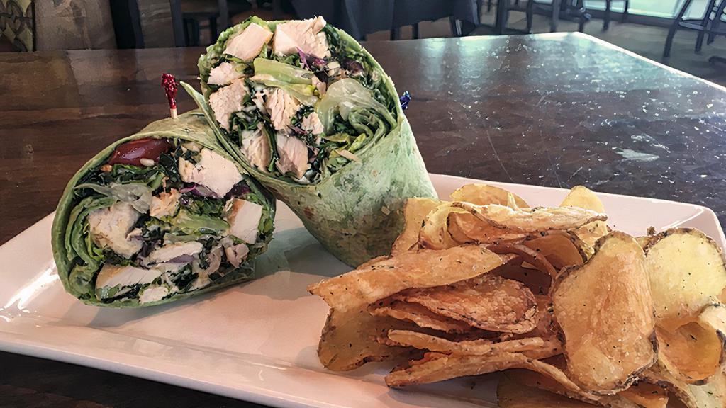 Chicken Caesar Wrap · Chilled, roasted chicken & chopped romaine lettuce, Caesar dressing, Parmesan & grape tomatoes in a flour tortilla.