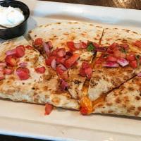 Chicken Quesadilla · Flour tortilla loaded w/cheddar cheese, roasted chicken, caramelized onions & peppers, serve...
