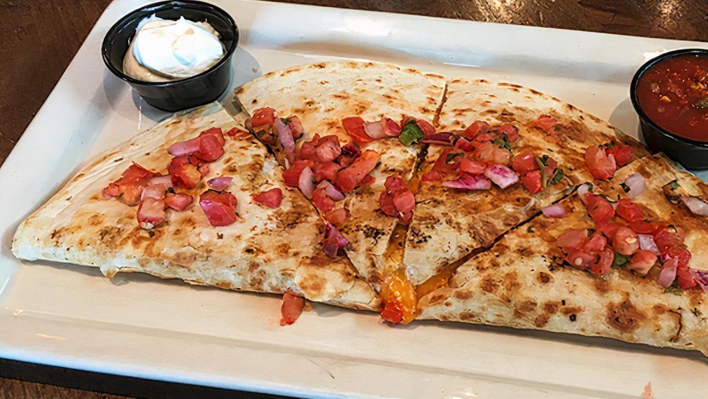 Chicken Quesadilla · Flour tortilla loaded w/cheddar cheese, roasted chicken, caramelized onions & peppers, served w/fire roasted salsa & sour cream.