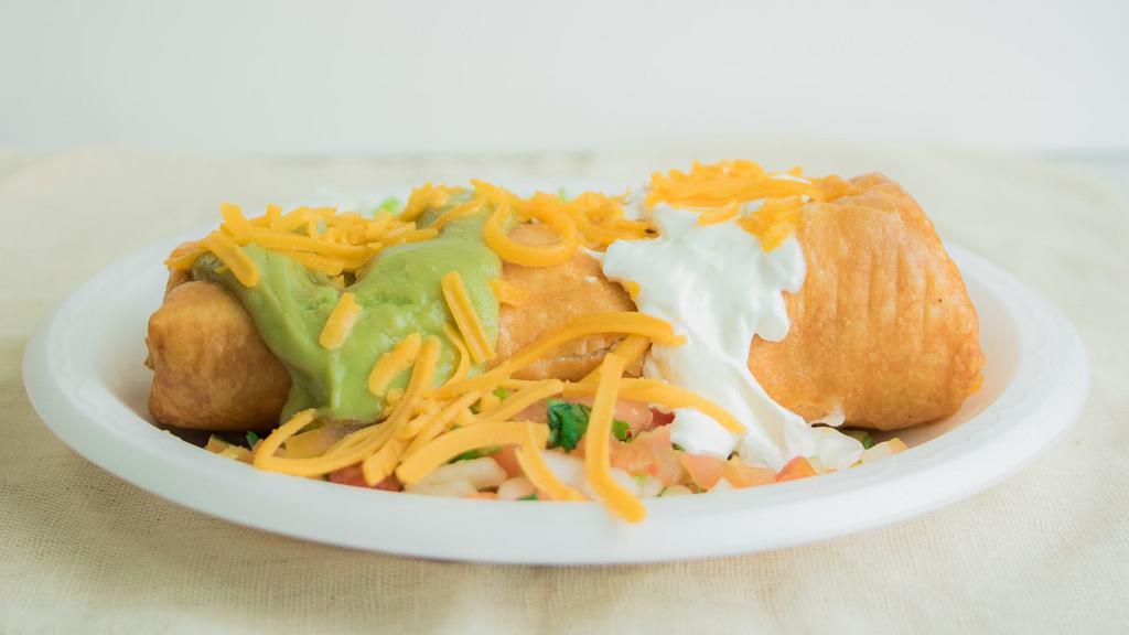Chicken · Chicken filled with beans and cheese with pico de gallo, lettuce, guacamole and sour cream.
