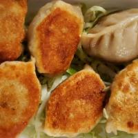 Pot Stickers (6) · Pork wrapped in flour skin pan-fried