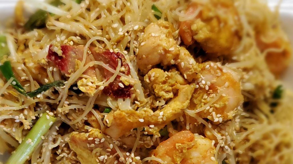 Singapore Rice Noodles · Thin rice noodles stir-fried  with chicken,  roast pork, and shrimp