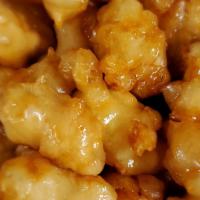 Orange Chicken · Chunks of chicken sauteed to be crispy and marinated with an orange sauce.