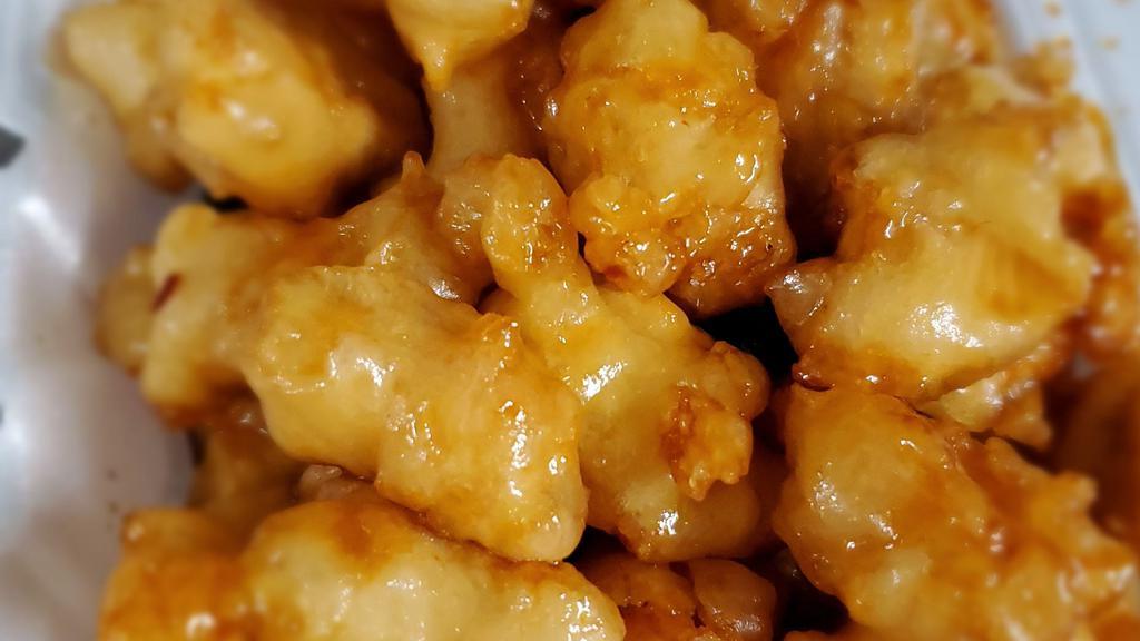 Orange Chicken · Chunks of chicken sauteed to be crispy and marinated with an orange sauce.