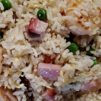 Yang Chow Fried Rice · Fried Rice with Roast Pork, Ham, Shrimp with Peas, carrots  and eggs