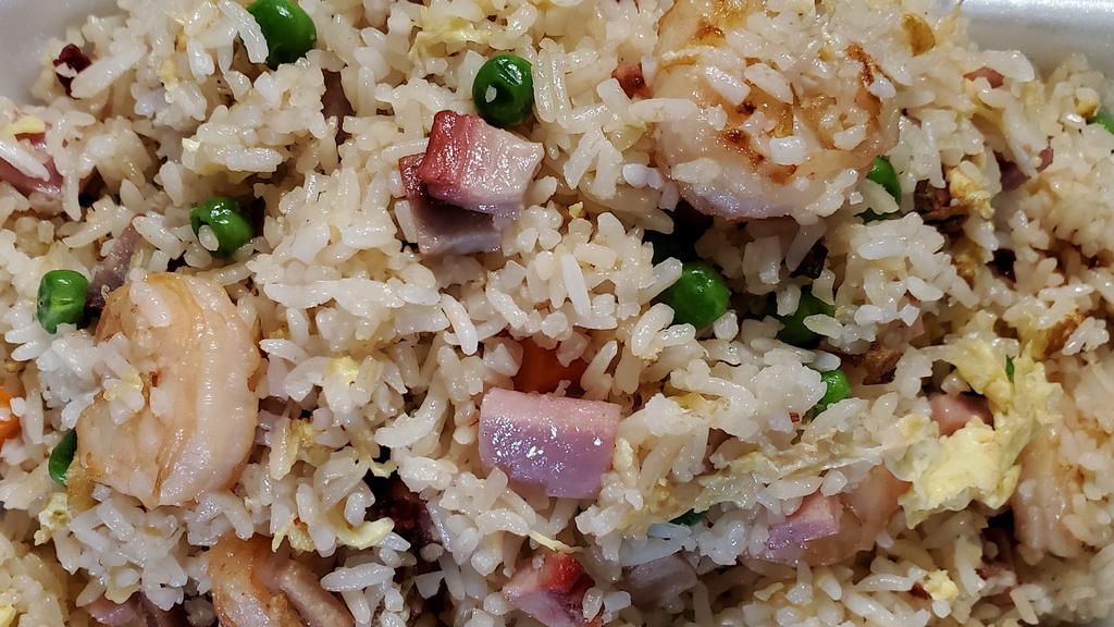 Yang Chow Fried Rice · Fried Rice with Roast Pork, Ham, Shrimp with Peas, carrots  and eggs