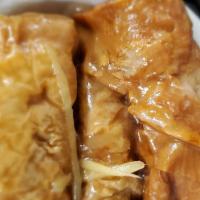 Pork With Bean Curd Skin Roll · Pork and Shrimp wrapped in bean curd skin stir fried with oyster sauce. 
3 pieces per order