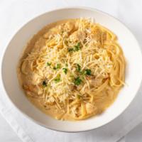 Fettuccine Alfredo · Classic creamy, Parmesan & garlic sauce, tossed with fettuccine pasta, topped with Parmesan ...