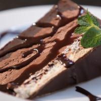 Chocolate Decadence · Layers of dark fudge, milk chocolate mousse, white chocolate mousse, covered with chocolate ...