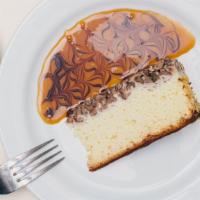 Turtle Cheesecake · Homemade cheesecake, butter pecan crust, decorated with sliced almonds, covered with chocola...