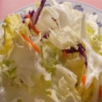 Salad · Romaine lettuce shredded carrots and red cabbage drizzled with salad dressing.