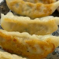 Gyoza (6 Pieces) · a Japanese dish consisting of wonton wrappers stuffed with pork and Chicken dumpling