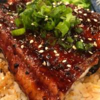 Unagi Don · Grilled Eel over rice, top with green onion and sesame, takuan