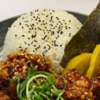 Spicy Chicken Karaage Don · Japanese Style spicy chicken with teriyaki sauce over rice, top with green onion, nori, taku...