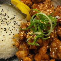 Chicken Karaage Don · Japanese style fried chicken with teriyaki sauce over rice, top with green onion, nori, taku...