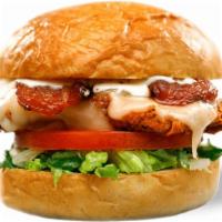 The Deluxe · Crispy chicken, bacon, pepper-jack cheese, tomato, shredded lettuce, buttermilk herb mayo
