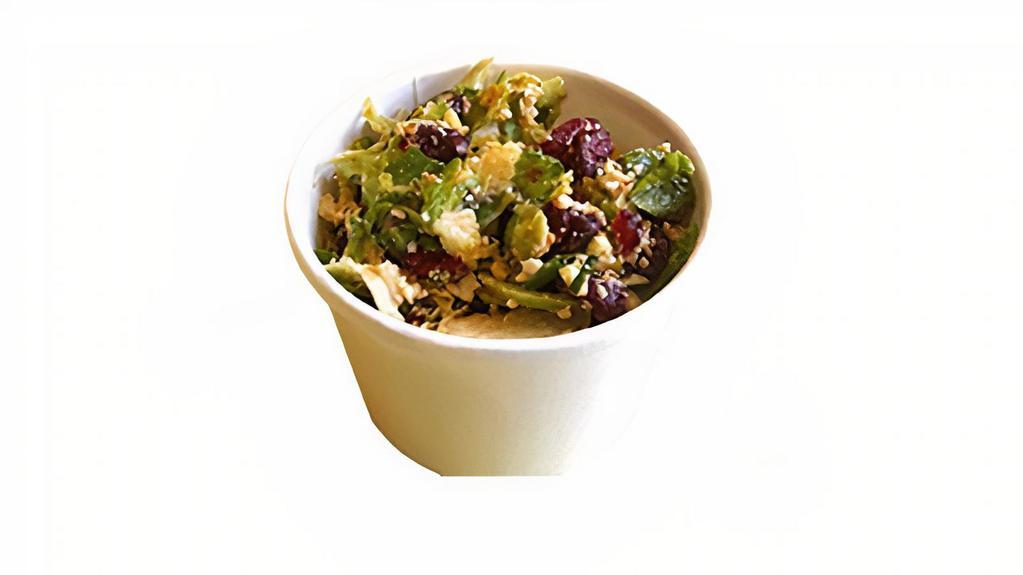 Shaved Brussel Sprout Salad · 8 oz Shaved sprouts, Toasted Pine Nuts, Dried cranberries, Pecorino Cheese, Chives, Oil, Lemon Juice, Custom Garlic Seasoning