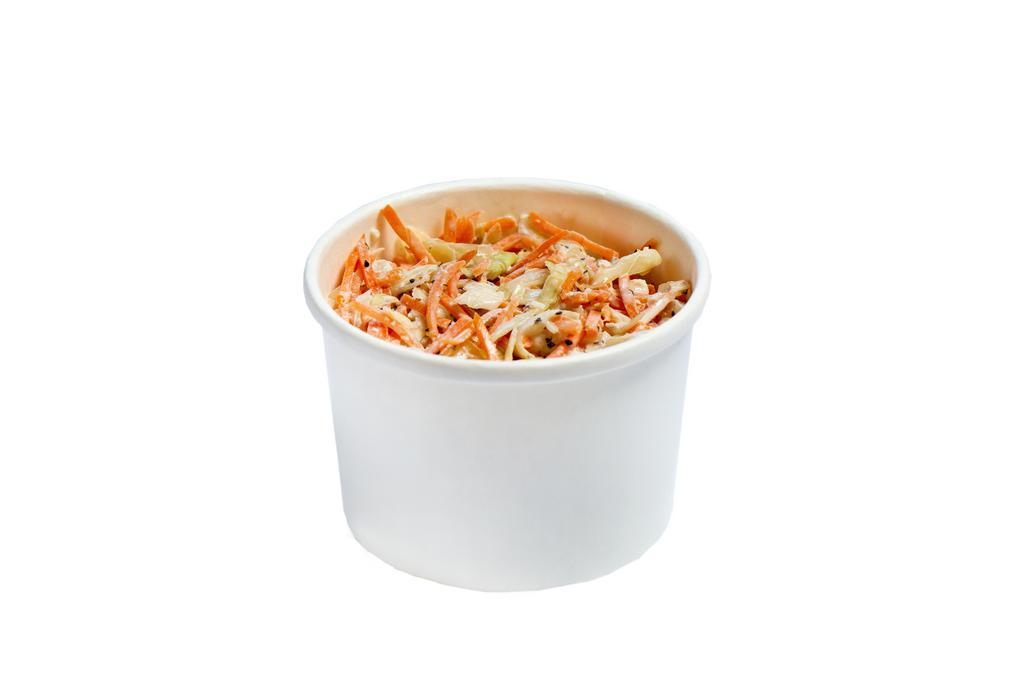Southern Slaw · 8oz of shredded white and red cabbage, carrots, tossed in our house-made herb mayo sauce