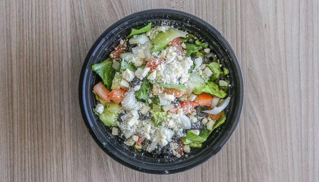 Greek Salad · Feta, cucumber, tomato, onion, and black olive. Includes romaine lettuce, croutons, and a dressing of your choice.