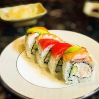 Rainbow Roll · Crab salad and cucumber inside topped with salmon, tuna, shrimp, and avocado.
