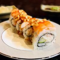 Ichi Roll · Crab salad and cucumber inside topped with shrimp, peanuts, and sweet chili sauce.