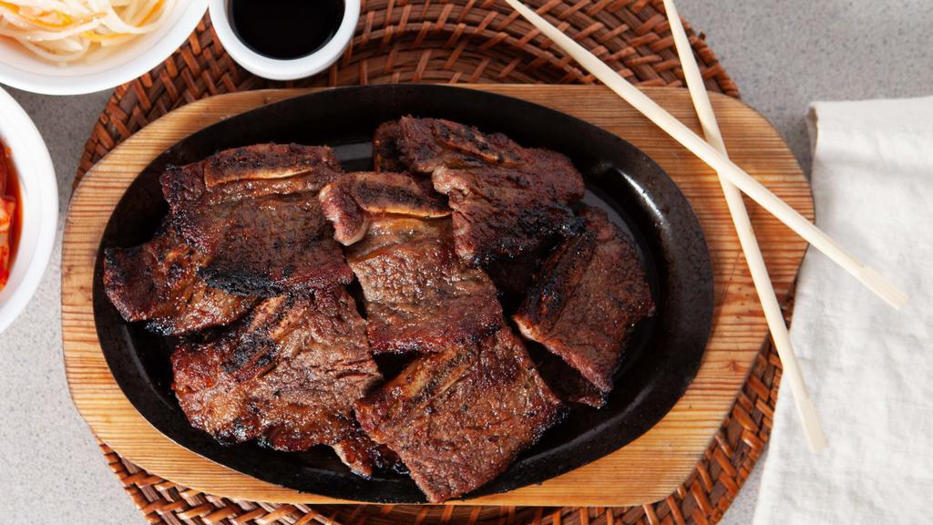 Kal Bi · Barbecued beef short ribs marinated in a  special sauce