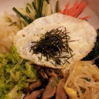 Bi Bim Bap · Vegetables, beef, and fried egg in steamed rice mixed your own way.