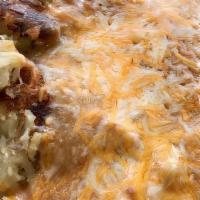 Huevos Rancheros* · Hash browns ~ 2 eggs ~ smothered in pork green chili ~ mixed cheese ~ refried beans ~ wheat,...
