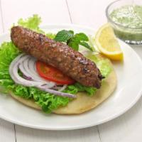 Lamb Kefta Kabab Sandwich · Juicy lamb kefta kabab served with lettuce, tomato, onion and tzatziki.