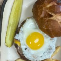 Bacon, Egg, & Cheese Burger · 1/3 pound Angus Beef patty topped with American cheese, crispy bacon, and a sunny side up eg...
