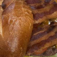 Bacon Cheeseburger · 1/3 pound Angus Beef patty topped with American cheese and Bacon on a soft pretzel bun.