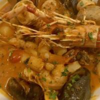 Cioppino · Spicy. Our signature seafood dish. Mixed seafood in a slightly spicy red sauce topped with a...