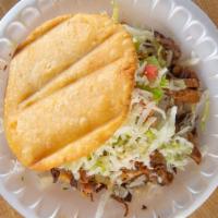 Gordita & Taco Combo · Two deep fried masa tortillas topped with beans meat lettuce onions hot sauce cheese guacamo...