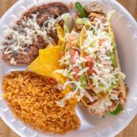 2 Tacos Hard Shell Combo · Two hard shell with choice of meat topped with lettuce tomatoes cheese guacamole onions and ...