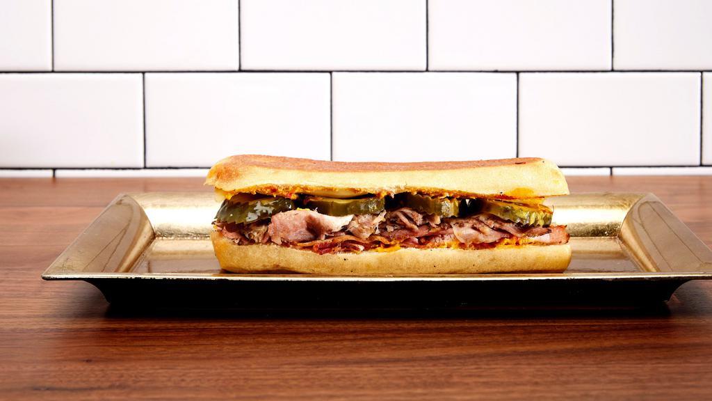 Cubano Italiana · Roasted Pork, Smoked Ham, Swiss, Pickles, House Mustard.