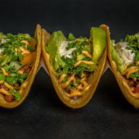 Bison Tacos · Organic corn tortilla filled with sautéed bison, bell pepper, onion. Topped with romaine let...