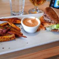 Bison Burger · 1/3-pound Bison patty topped with grilled onion, tomato, romaine lettuce,
zesty raw cashew c...