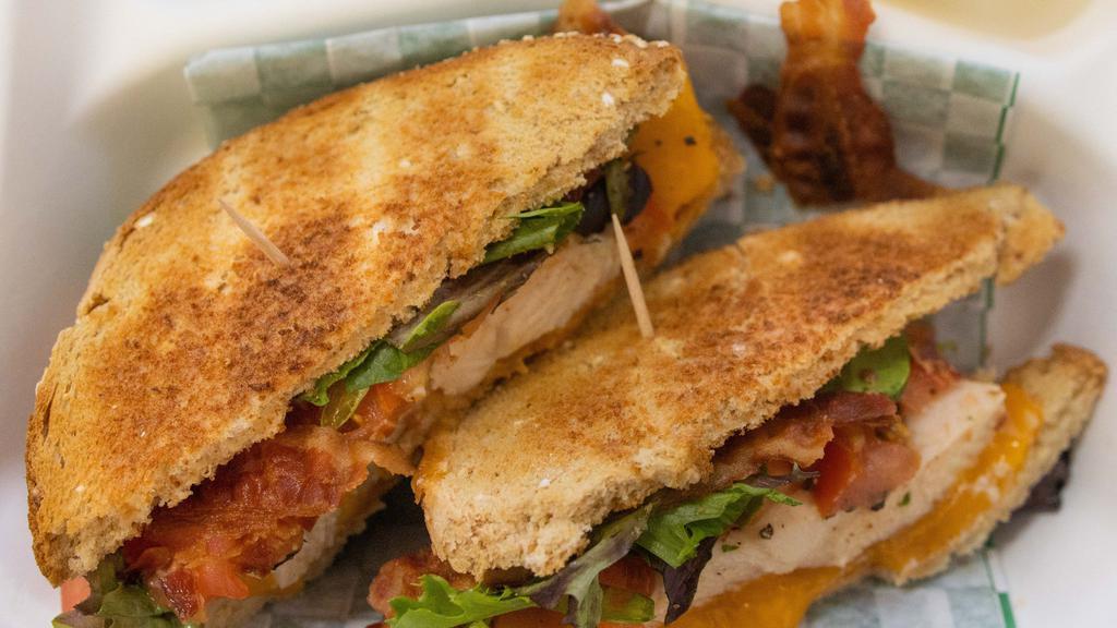 #1A. Ta Signature Chicken Bacon Sandwich On Wheat Bread · Our Classic BLT layered with sliced Baked Chicken Breast.