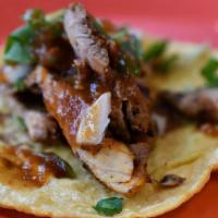 Tacos De Pollo Asado · Grilled chicken.