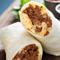 Carnitas Breakfast Burrito · Delicious, flavorful, slow braised, fall apart pork cooked with traditional spices such as c...