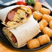 Sausage Breakfast Burrito · Juicy sausage, eggs, and cheese wrapped in a large warm flour tortilla.