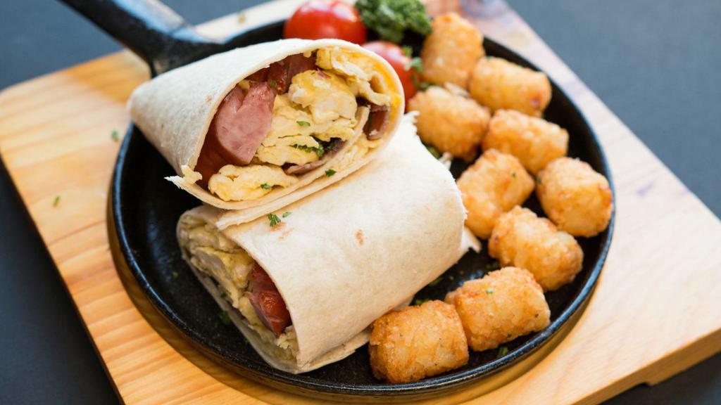 Sausage Breakfast Burrito · Savory breakfast sausage with two fluffy scrambled eggs, melty 3 cheese blend all wrapped in a large 12 inch, soft flour tortilla.