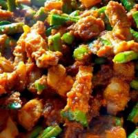Pad Pik Khing · Stir-fried meat with red curry paste, bell pepper, green bean and lemon leaves.