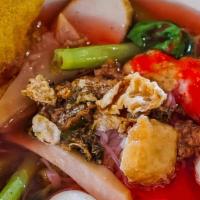 Boat Noodle #9 (Yen Ta Fo) · Shrimp calamari, fried tofu, white mushrooms in pink broth topped with fried garlic, cilantr...