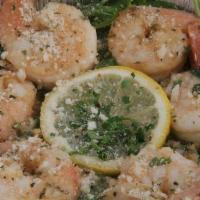 #4 Shrimp Scampi · Sauteed in a garlic white wine lemon butter sauce. Served with Garlic Knot