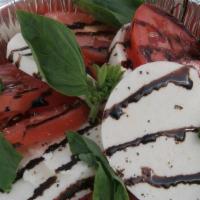 #12 Caprese Salad · House Made Mozzarella, Tomato, Fresh Basil, and finished with a Balsamic drizzle