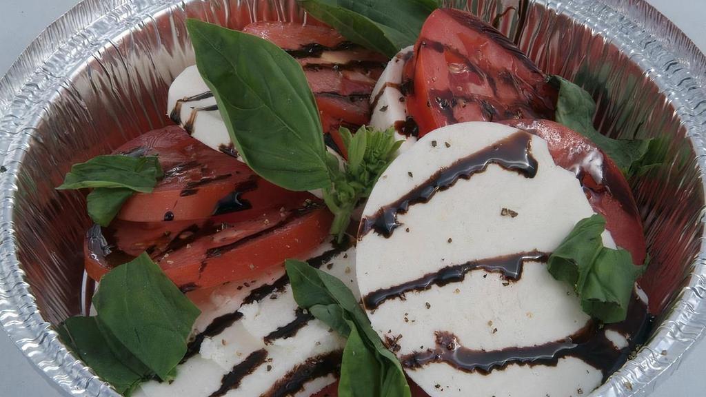 #12 Caprese Salad · House Made Mozzarella, Tomato, Fresh Basil, and finished with a Balsamic drizzle