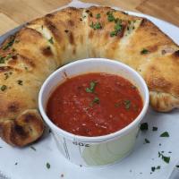 #23 Stromboli · Mozzarella Blend, Pepperoni, Salami, and Ham