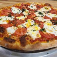 #14 Large Margherita · House-Made Fresh Mozzarella, House Red Sauce, Fresh Basil, and EVOO