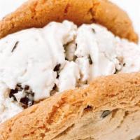 Ice Cream Cookie Sandwich  · A single scoop of ice cream smashed between 2 of our delicious chocolate chip cookies.